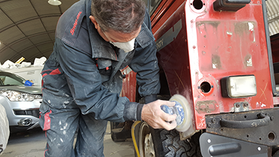 A craftsman from RSV Refinishers Westbury working on a vehicle repair